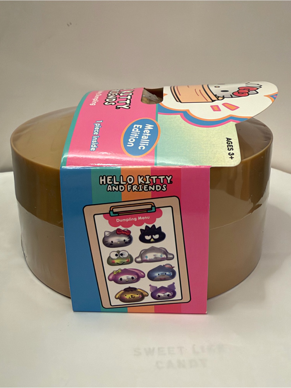 Hello Kitty Metallic Edition Mystery Squishy - Brown Container